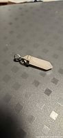Rose quartz point pendant angled view showing cap and bail