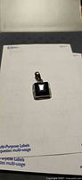 Front view of sterling silver square onyx pendant