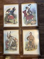 All four framed Highlander prints arranged together