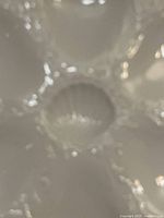 Close-up of central shell-shaped sauce well