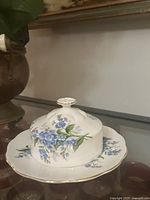 Butter dish assembled showing floral pattern and gold trim