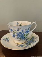 Teacup on saucer, Forget Me Not pattern visible