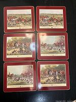 All six placemats showing three different hunting scene prints, front view