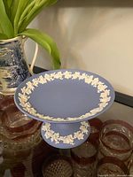 Side view showing overall shape and applied relief decoration