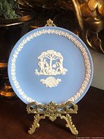 Full view of blue Jasperware plate on stand