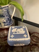 Trinket box with lid in place showing relief decoration