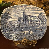 Front of blue and white Wood & Sons platter showing coach scene