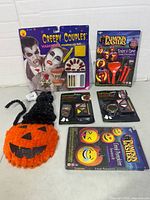 Group shot of six Halloween makeup and decoration items