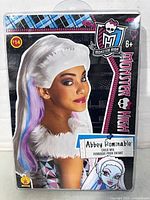 Front of sealed retail package showing Monster High Abbey Bominable wig