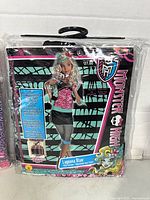 Front of sealed Monster High Lagoona Blue costume package shows size and character