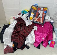 Overall pile of costume pieces with Star Wars package visible