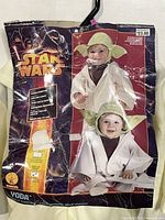 Front of packaging showing Yoda toddler costume images and branding
