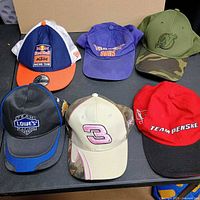 All six caps displayed on table