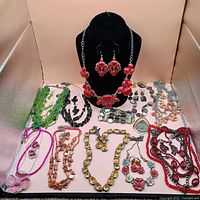 All ten necklace and earring sets laid out for overview