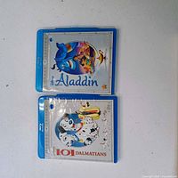 Front view of both Disney Blu-ray cases: Aladdin above 101 Dalmatians