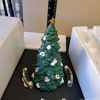 Porcelain tree with star and benches alongside ruler