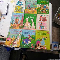 All nine Disney hardcover books laid out in 3x3 grid