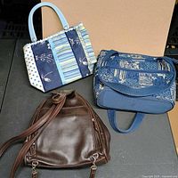 Overview of three handbags arranged on table