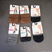 All six sealed Hanes hosiery packages laid out