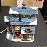 Front view of ceramic Eagle Creek Mill lighted house