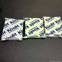 Three Koolit refrigerant gel packs side by side