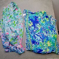 Both scarves laid flat showing colors and patterns