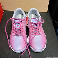 Top view of both sneakers showing color, laces and condition