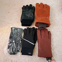 Group shot of all five pairs of men’s gloves