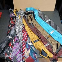 Pile of 12 assorted ties laid out