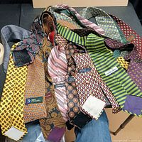 Pile of assorted ties showing quantity and variety
