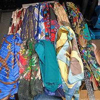 All ten scarves laid side-by-side showing variety of prints