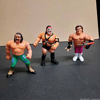 Front view of all three figures standing