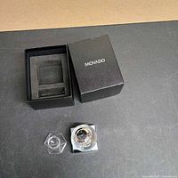 Clock, acrylic stand and Movado box overview