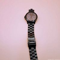 Full view of MVMT wristwatch showing broken link band