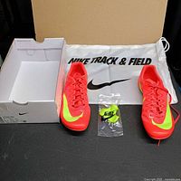 Pair of cleats with box interior and spike packet