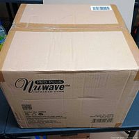 Sealed box front showing Nuwave Pro Plus Infrared Oven branding