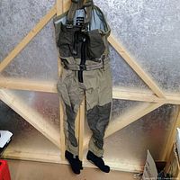 Full view of Simms chest waders hanging