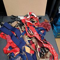 Pile of assorted suspenders showing variety of colors and patterns