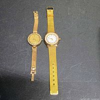 Front view of both gold-tone ladies watches