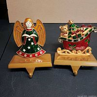 Front view of both stocking holders showing designs