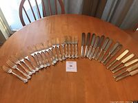 Overview of entire 41-piece flatware set on table