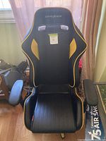 Full front view of DXRacer chair showing overall design, color scheme and wear