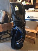Full view of Founders Club blue and black golf bag with hood attached
