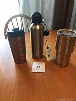 Group shot of three stainless drinkware pieces