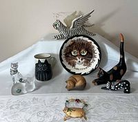 Group shot of all nine cat-themed items