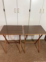 Two folding TV trays side by side