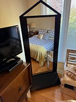 Mirror front view showing frame shape and reflective surface