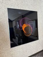 Full view of framed print on wall