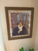 Front view of framed fruit print within ornate frame