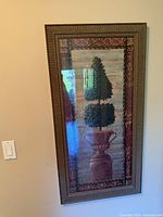 Full view of framed print hanging on wall